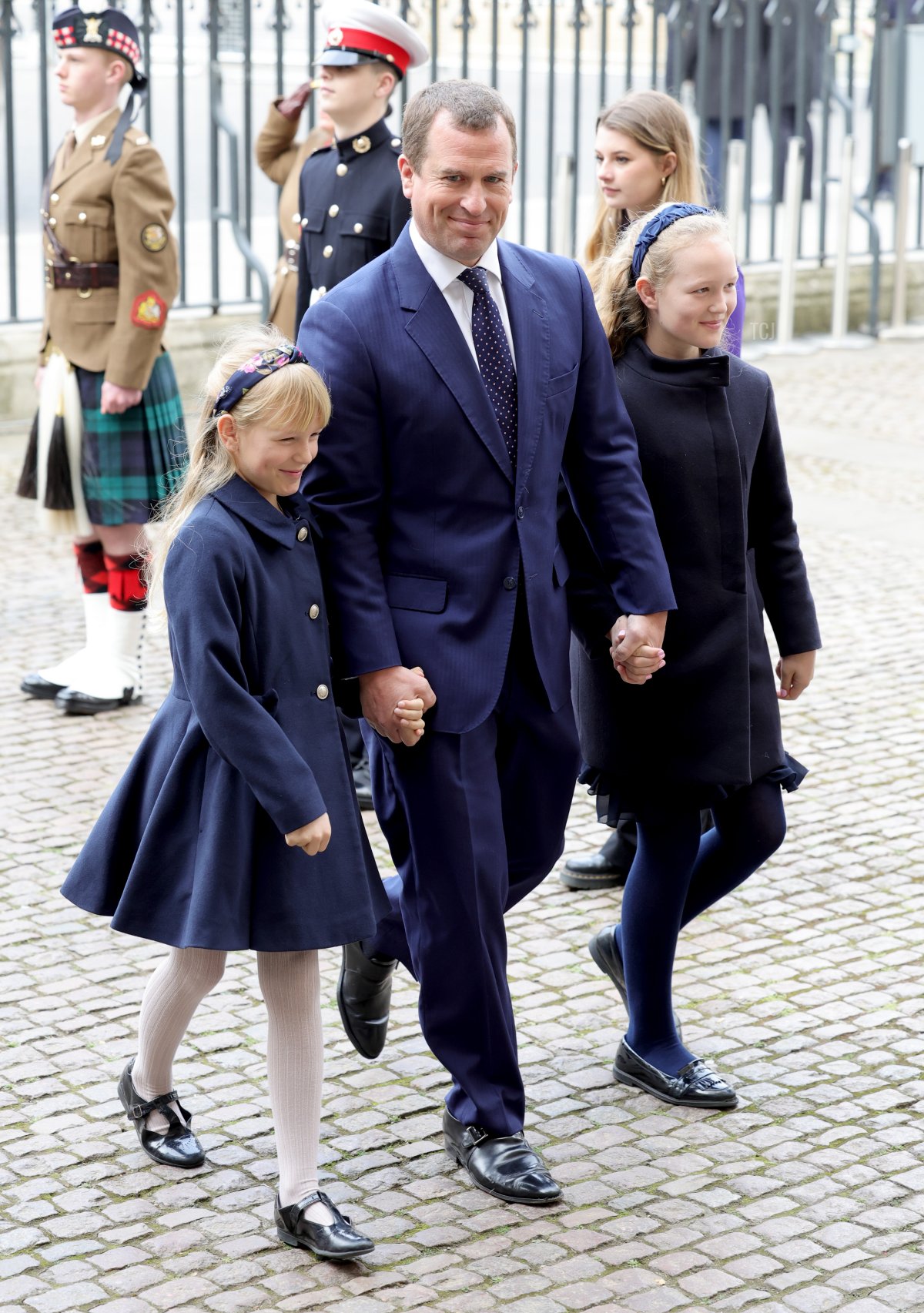 Isla Phillips, Peter Phillips and Savannah Phillips attend the memorial service for the Duke Of Edinburgh at Westminster Abbey on March 29, 2022 in London, England