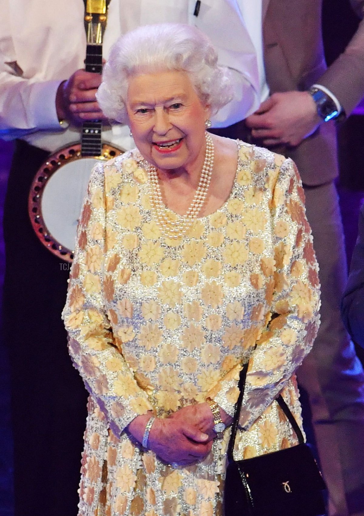 Britain's Prince Charles, Prince of Wales (R) leads a tribute to his mother Britain's Queen Elizabeth II as they join the performers on stage during The Queen's Birthday Party concert on the occassion of Her Majesty's 92nd birthday at the Royal Albert Hall in London on April 21, 2018