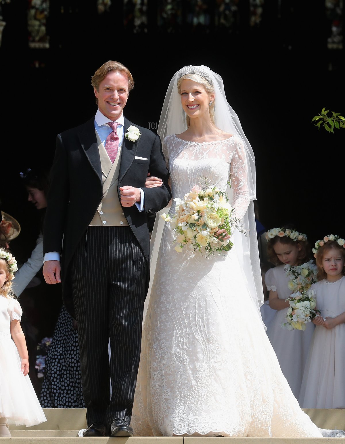 Newlyweds Mr Thomas Kingston and Lady Gabriella Windsor share a kiss on the steps of the chapel after their wedding at St George's Chapel on May 18, 2019 in Windsor, England
