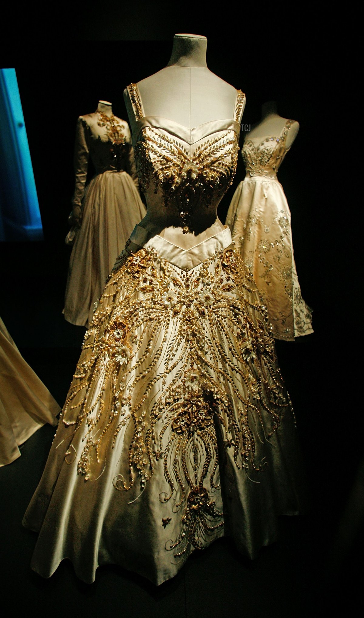 'Flowers of the Fields of France' a ceremonial gown designed for HM Queen Elizabeth II by Norman Hartnell from 1957 is displayed at the Golden Age Of Couture Exhibition at The V&A Museum on September 19, 2007 in London