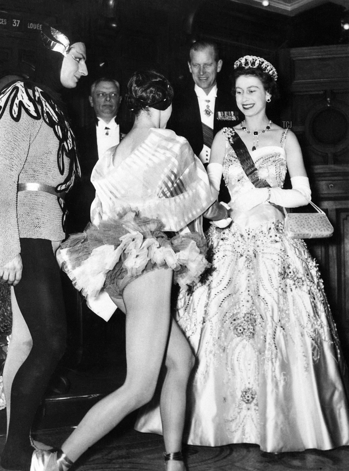 Queen Elizabeth II and Duke of Edinburgh greet French dancers Lyane Dayde and Michel Renault at the Opera Garnier in Paris during a state visit to France on April 9, 1957 (AFP via Getty Images)