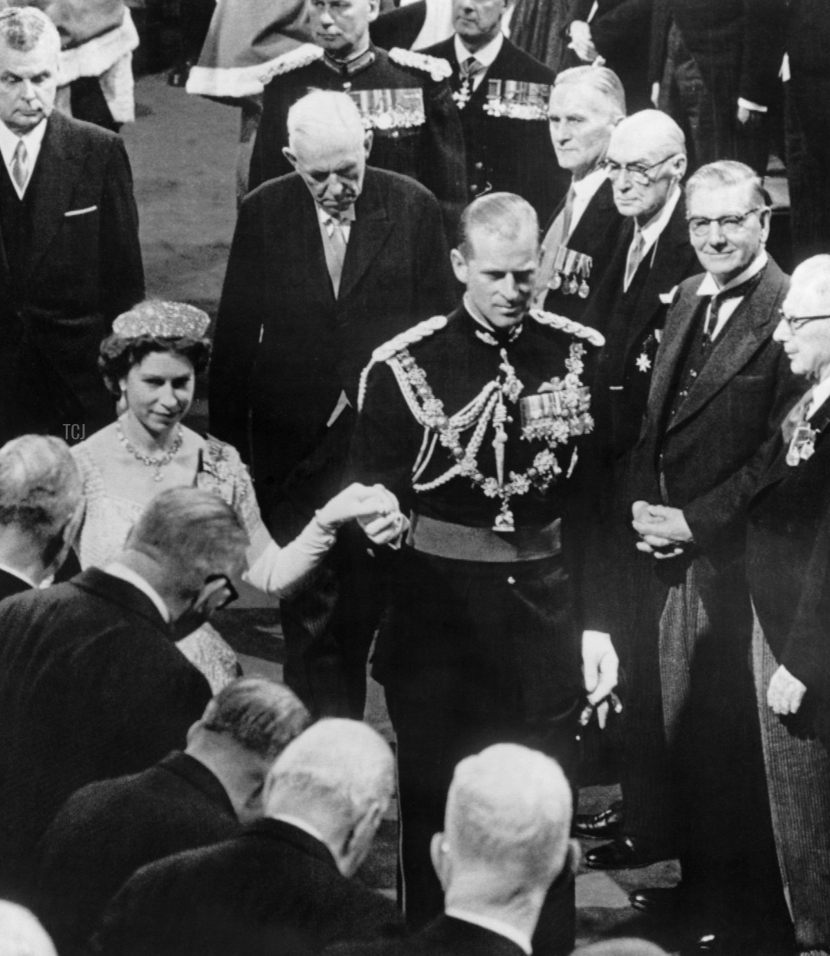 Britain's Queen Elizabeth II and Prince Philip, Duke of Edinburgh (L) arrive with Canadian prime Minister John Diefenbaker (background left) for the opening of the 23th democratic Congress in Ottawa on October 14, 1957