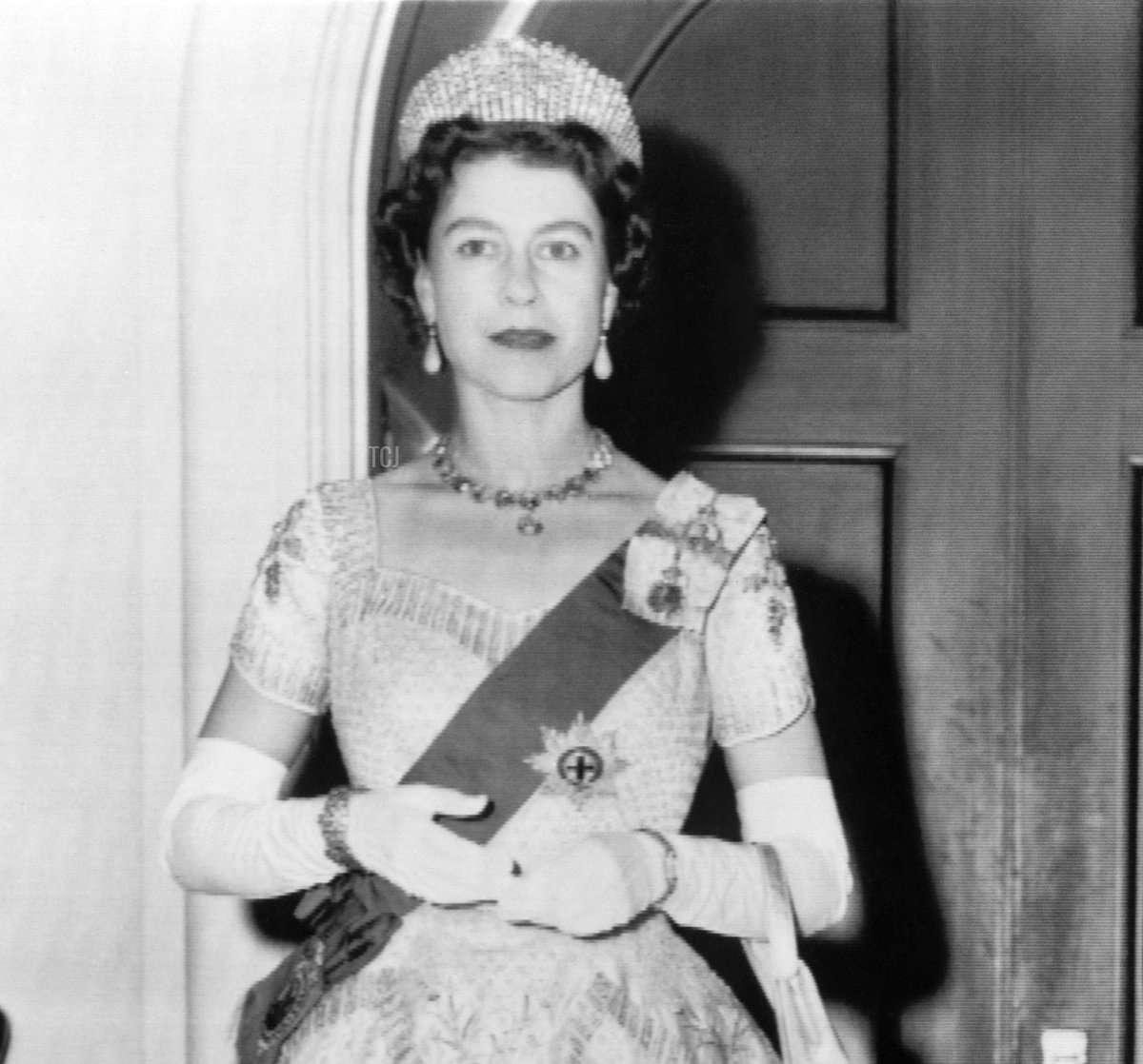 Queen Elizabeth II poses at the Government house before attending the ceremonies marking the opening of Parliament in Ottawa on October 14, 1957 during a state visit in Canada