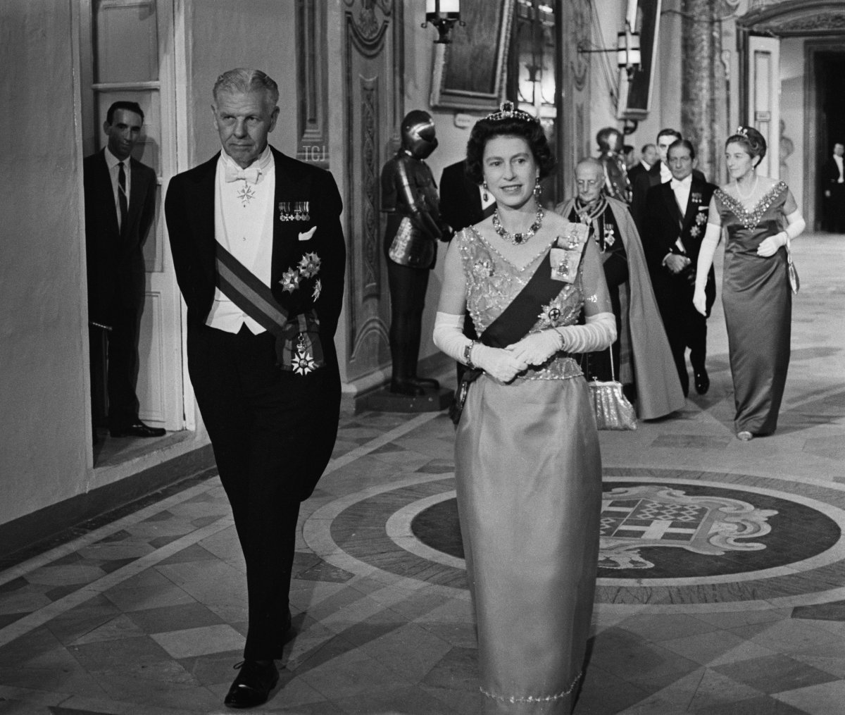 Queen Elizabeth II attends a banquet during a Commonwealth visit to Malta, accompanied by Maurice Henry Dorman (1912 - 1993), the Governor-General of Malta, 14th November 1967