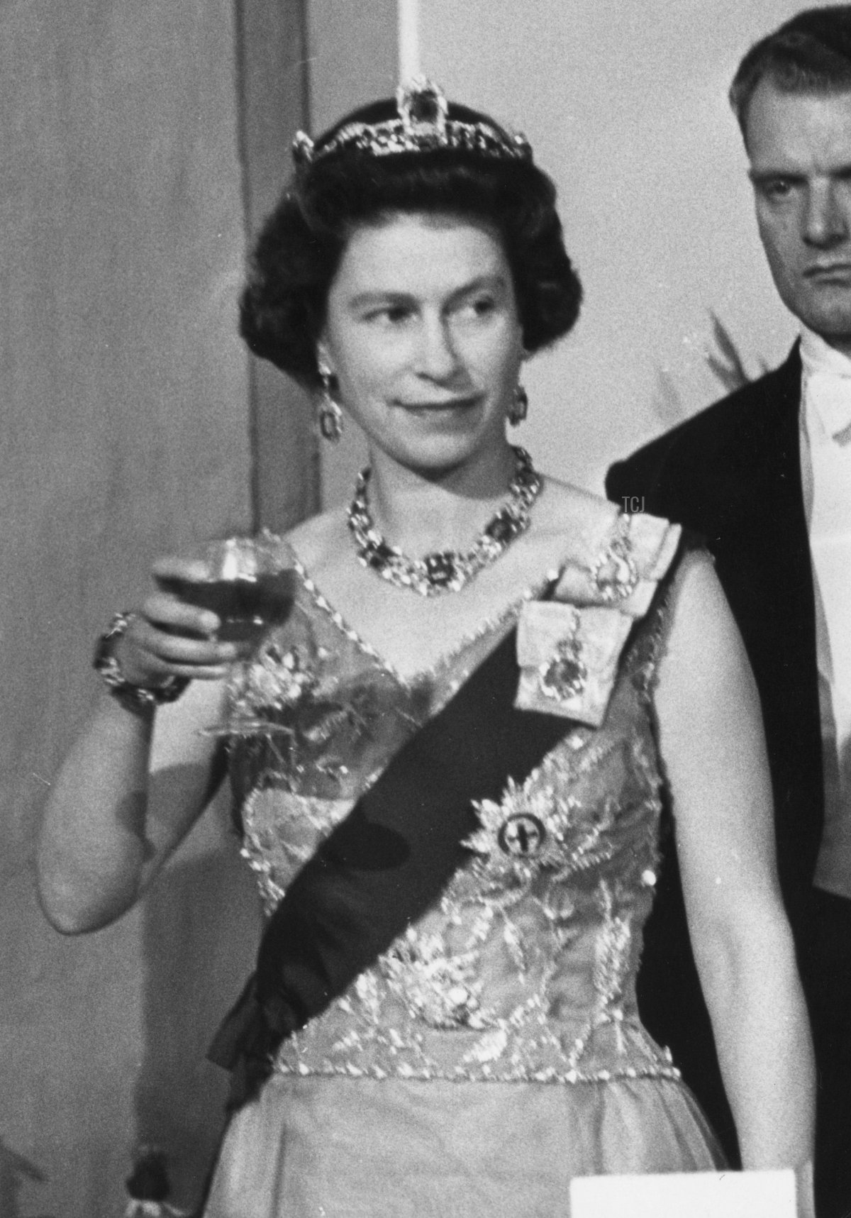 Queen Elizabeth II attends a banquet during a Commonwealth visit to Malta, accompanied by Maurice Henry Dorman (1912 - 1993), the Governor-General of Malta, 14th November 1967