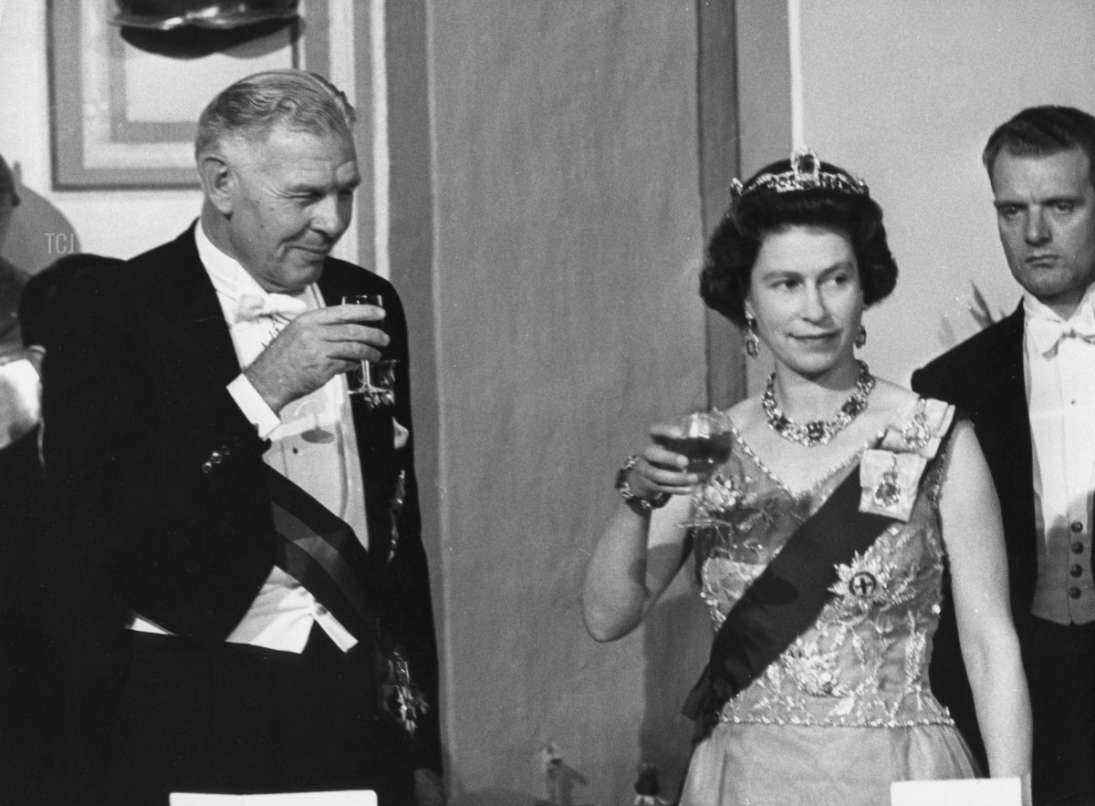 Queen Elizabeth II attends a banquet during a Commonwealth visit to Malta, accompanied by Maurice Henry Dorman (1912 - 1993), the Governor-General of Malta, 14th November 1967