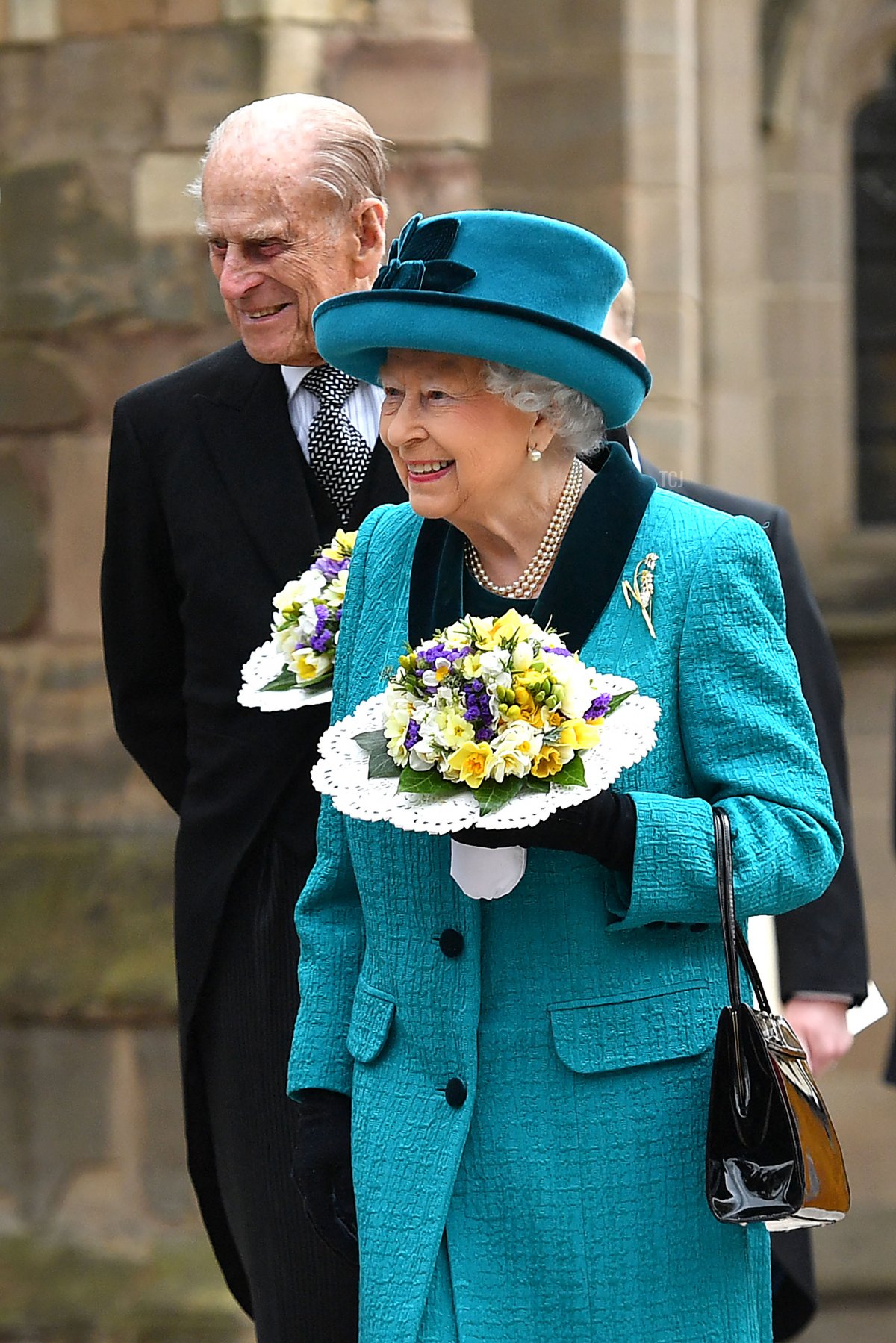 Britain's Queen Elizabeth II and Britain's Prince Philip, Duke of Edinburgh meet former servicemen following the Royal Maundy service at Leicester Cathedral on April 13, 2017 in Leicester