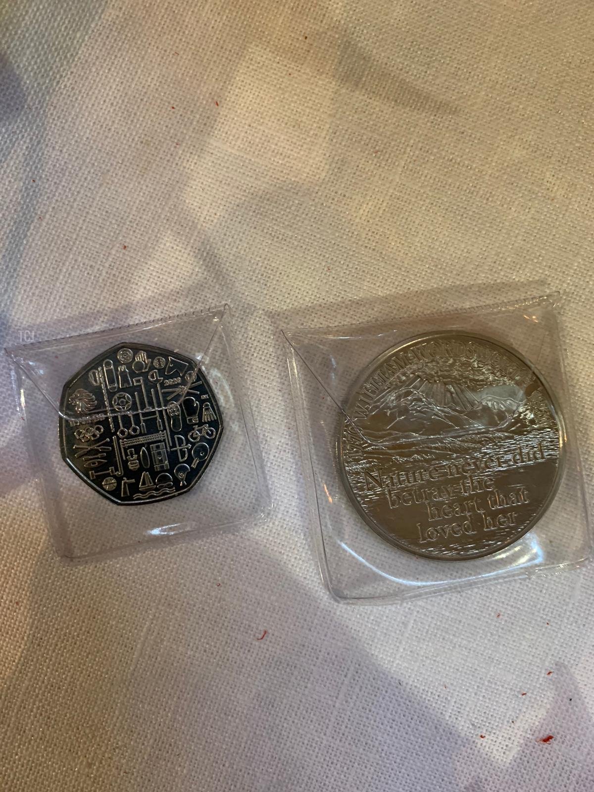 In this handout photo issued by Buckingham Palace, the specially-minted Maundy money usually given in person at the Royal Maundy Service in St. Georges Chapel, Windsor Castle, is displayed before it is sent by post to 188 recipients along with a letter from Queen Elizabeth II, on April 9, 2020 in London, England