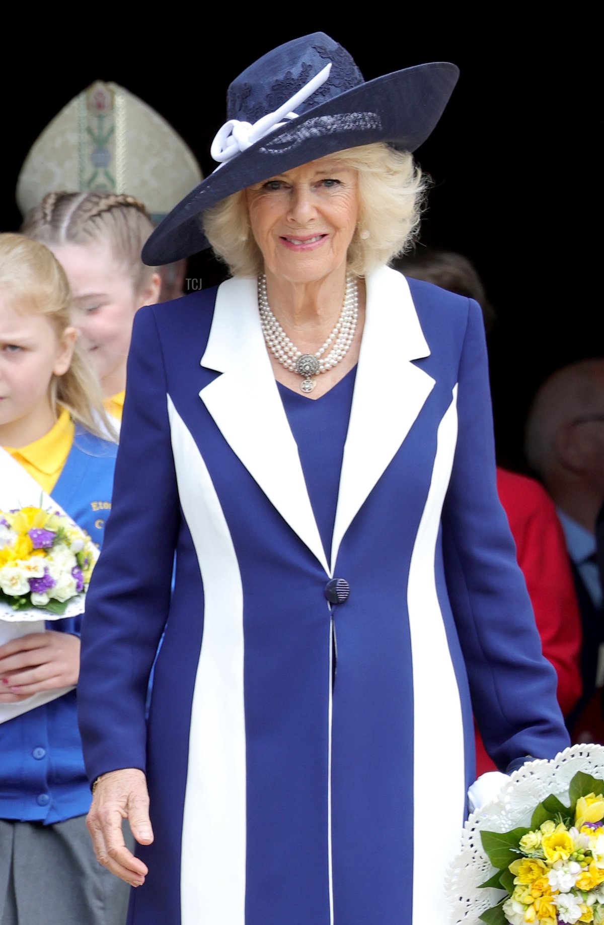 Camilla, Duchess of Cornwall holds a nosegay as she attends the Royal Maundy Service at St George's Chapel on April 14, 2022 in Windsor, England