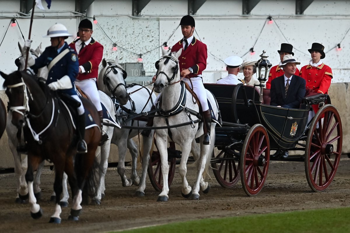 Britain's Princess Anne and Vice Admiral Timothy Laurence ride in a horse-drawn carriage during the opening ceremony of the Royal Easter Show in Sydney on April 9, 2022