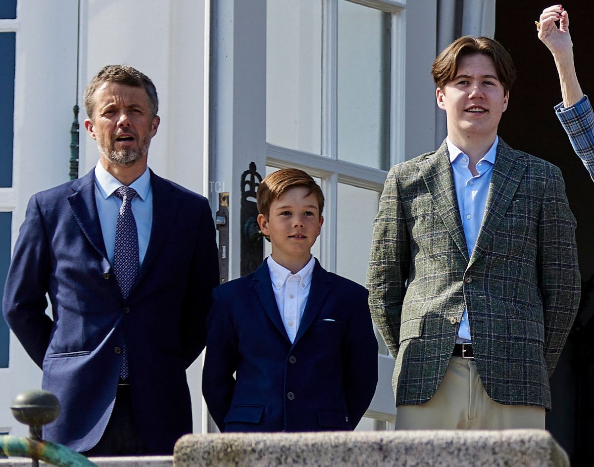 Denmark's Queen Margrethe II (C) greets well-wishers as Crown Prince Frederik (1st L), Prince Vincent (2ndL), Prince Christian (3rd L), Princess Isabella (3rd R), Crown Princess Mary (2nd R) and Princess Josephine (1st R) stand from the balcony of Marselisborg Castle in Aarhus, on April 16, 2022, on the occasion of her 82nd birthday