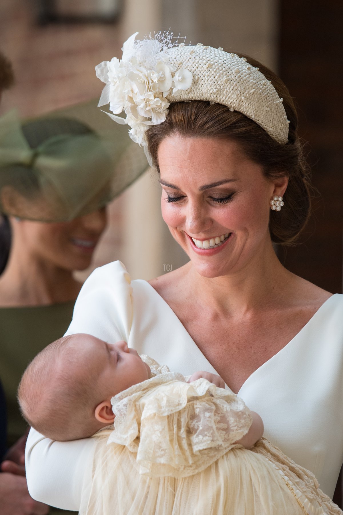Catherine, Duchess of Cambridge carries Prince Louis as they arrive for his christening service at St James's Palace on July 09, 2018 in London, England