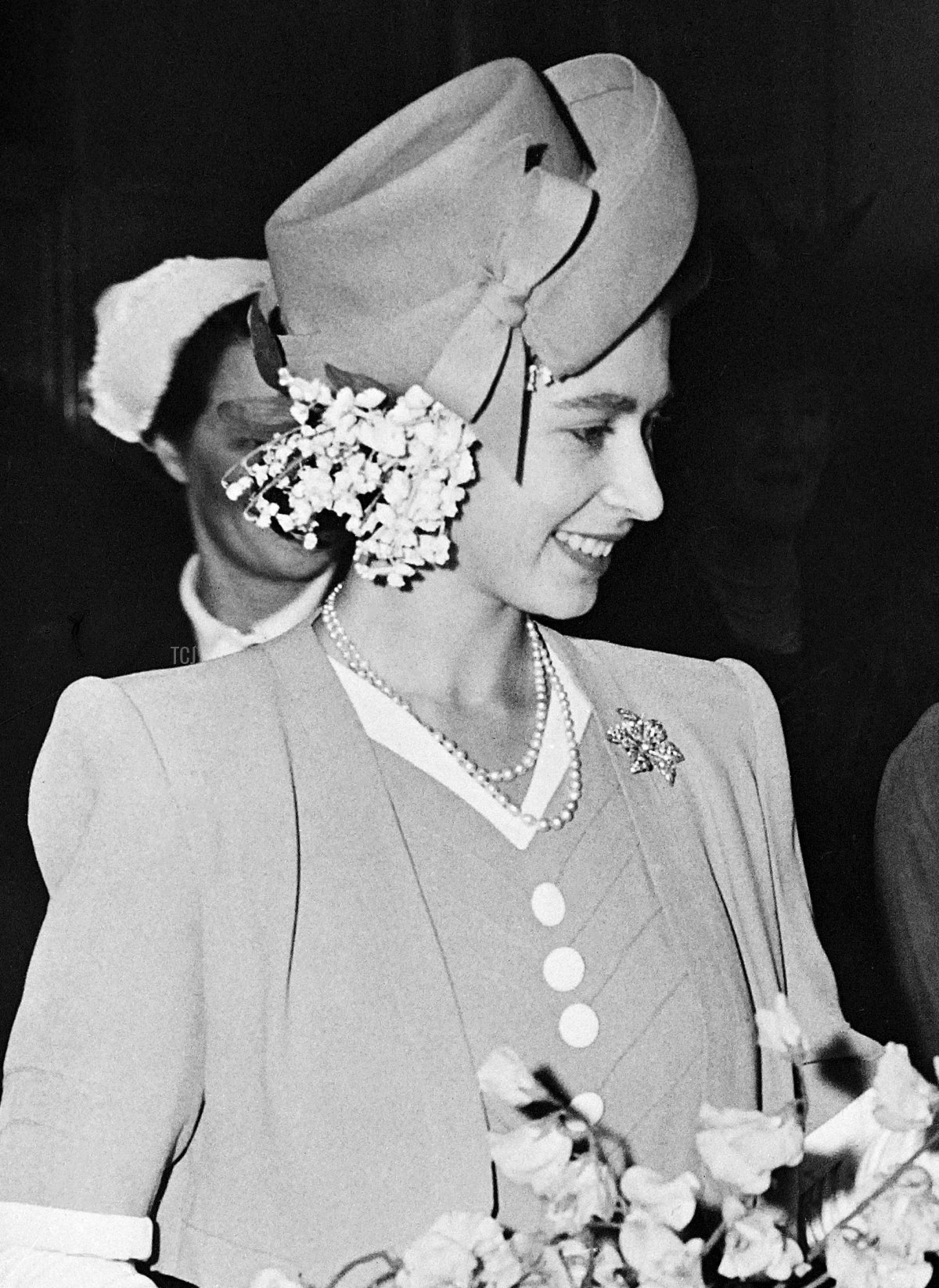 Princess Elizabeth reaches out to a little girl in May 1947