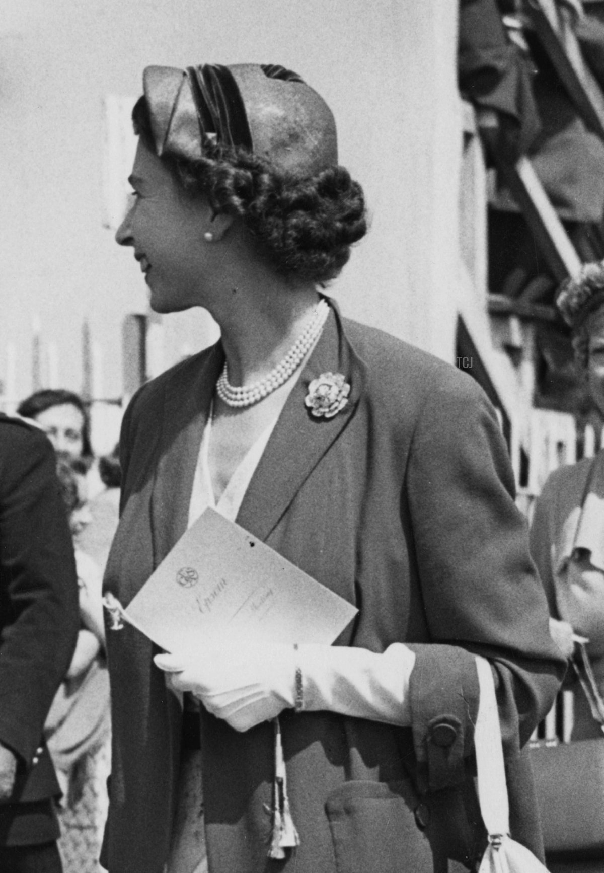 Queen Elizabeth II with racehorse owner Sir Humphrey de Trafford (1891 - 1971) on Ladies' Day at Epsom Downs Racecourse, Surrey, 4th June 1954