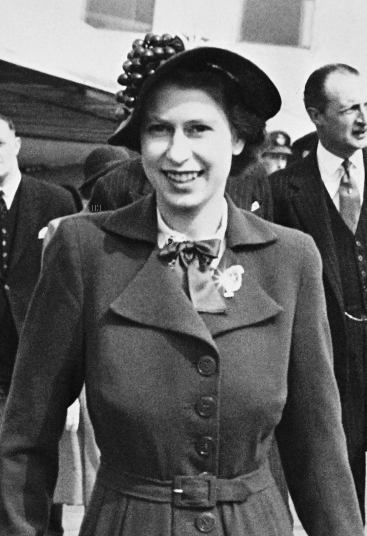 Prince Charles welcomes his mother Princess Elizabeth II upon her arrival at London airport back from her trip in Italy, on April 25, 1951