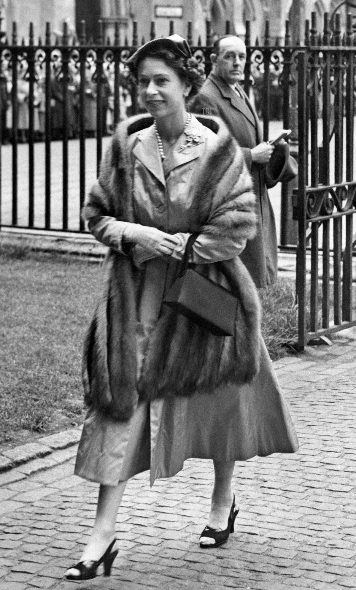 Queen Elizabeth II and Prince Philip, Duke of Edinburgh arrive at Westminster Abbey in London for the wedding of Frances Roche and John Spencer, Viscount Althorp on June 1, 1954