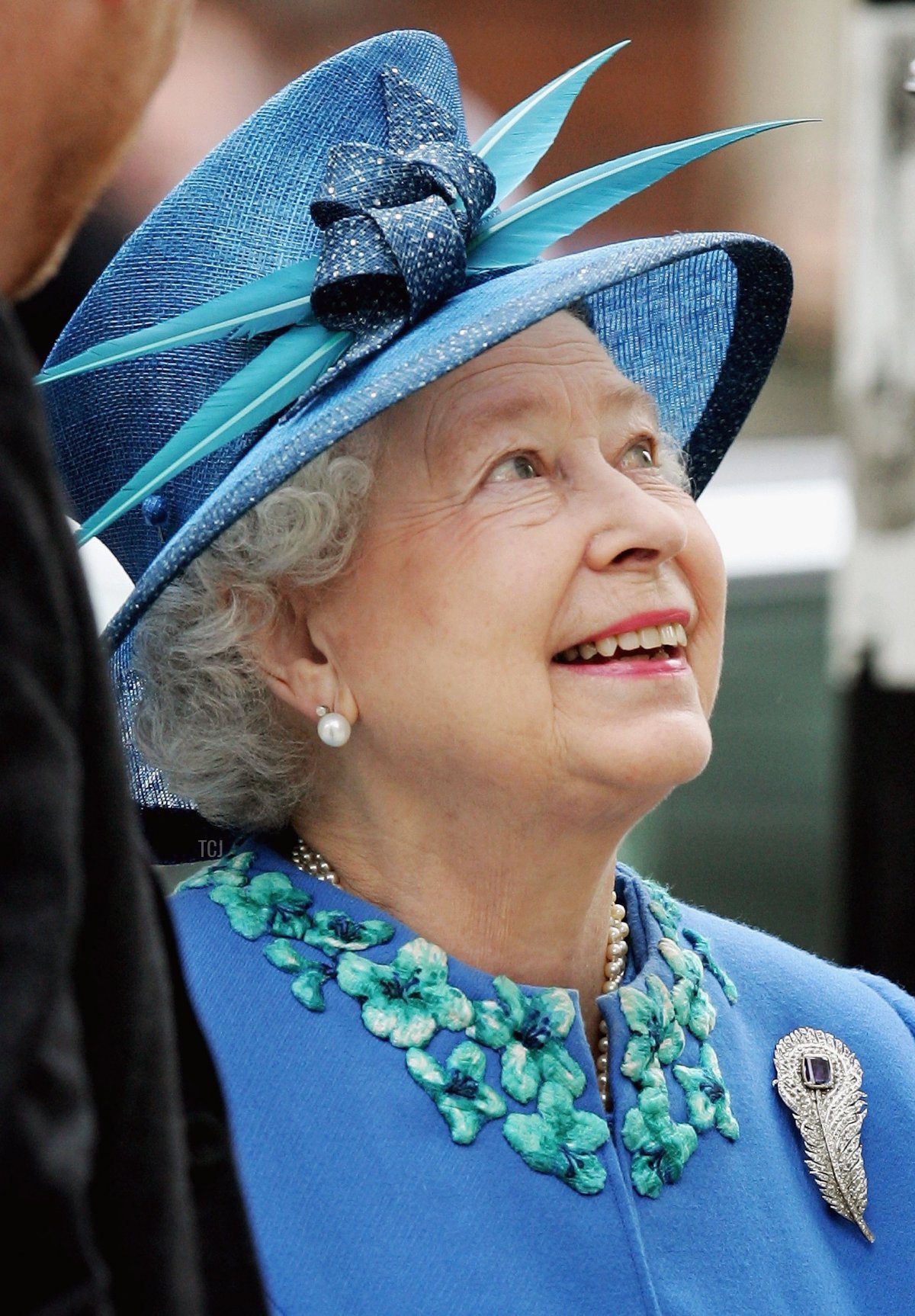 Queen Elizabeth II meets school children as she leaves BBC Broadcasting House to mark the anniversary of the granting of the Corporation's Royal Charter ahead of her 80th birthday tomorrow on April 20, 2006 in London, England
