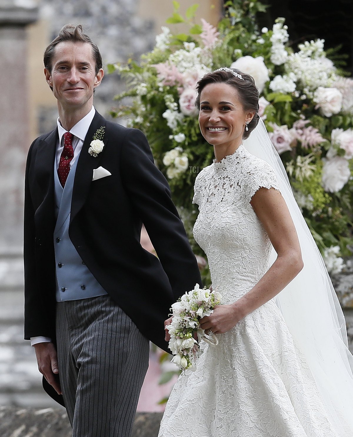 Pippa Middleton and James Matthews smile for the cameras after their wedding at St Mark's Church on May 20, 2017 in Englefield, England