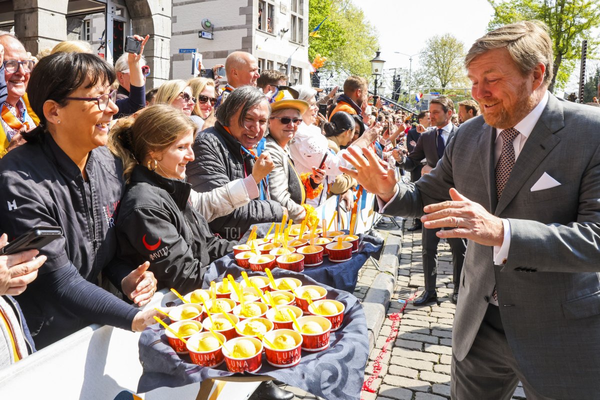 King Willem-Alexander is offered an ice cream during King's Day in Maastricht, on April 27, 2022