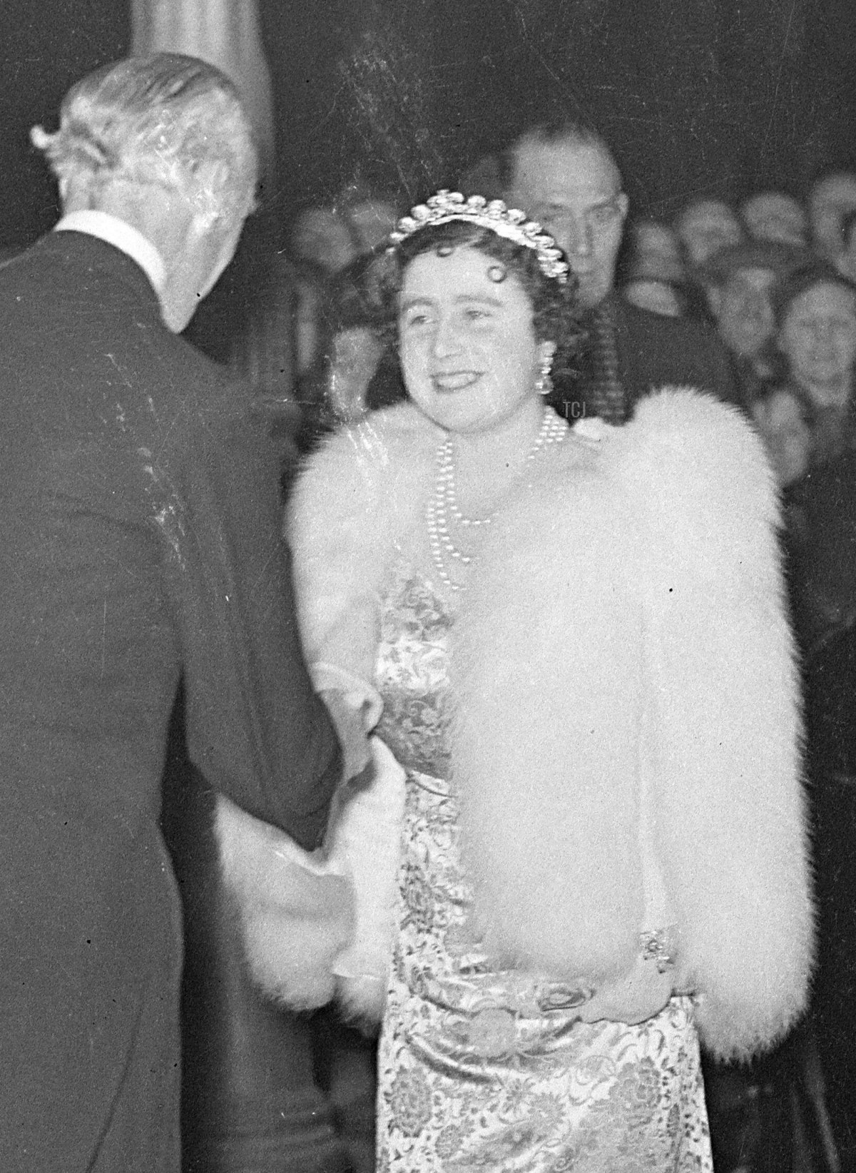 Queen Elizabeth of the United Kingdom (later the Queen Mother) wears the Cartier Halo Tiara for a special performance of Macbeth (which is, of course, set at her childhood home of Glamis Castle) at the Old Vic in aid of the Centenary Fund of the Kings College Hospital, November 1937