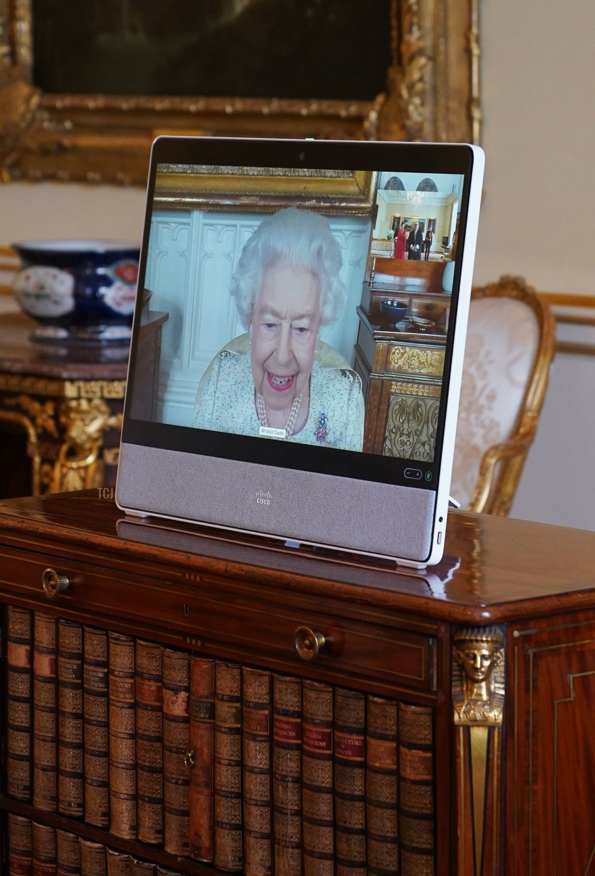 Queen Elizabeth II, in residence at Windsor Castle, appears on a screen via videolink, during a virtual audience to receive Dr. Emmanuel Mallia, High Commissioner for the Republic of Malta, and his wife Elena Codruta, at Buckingham Palace on April 29, 2022 in London, England