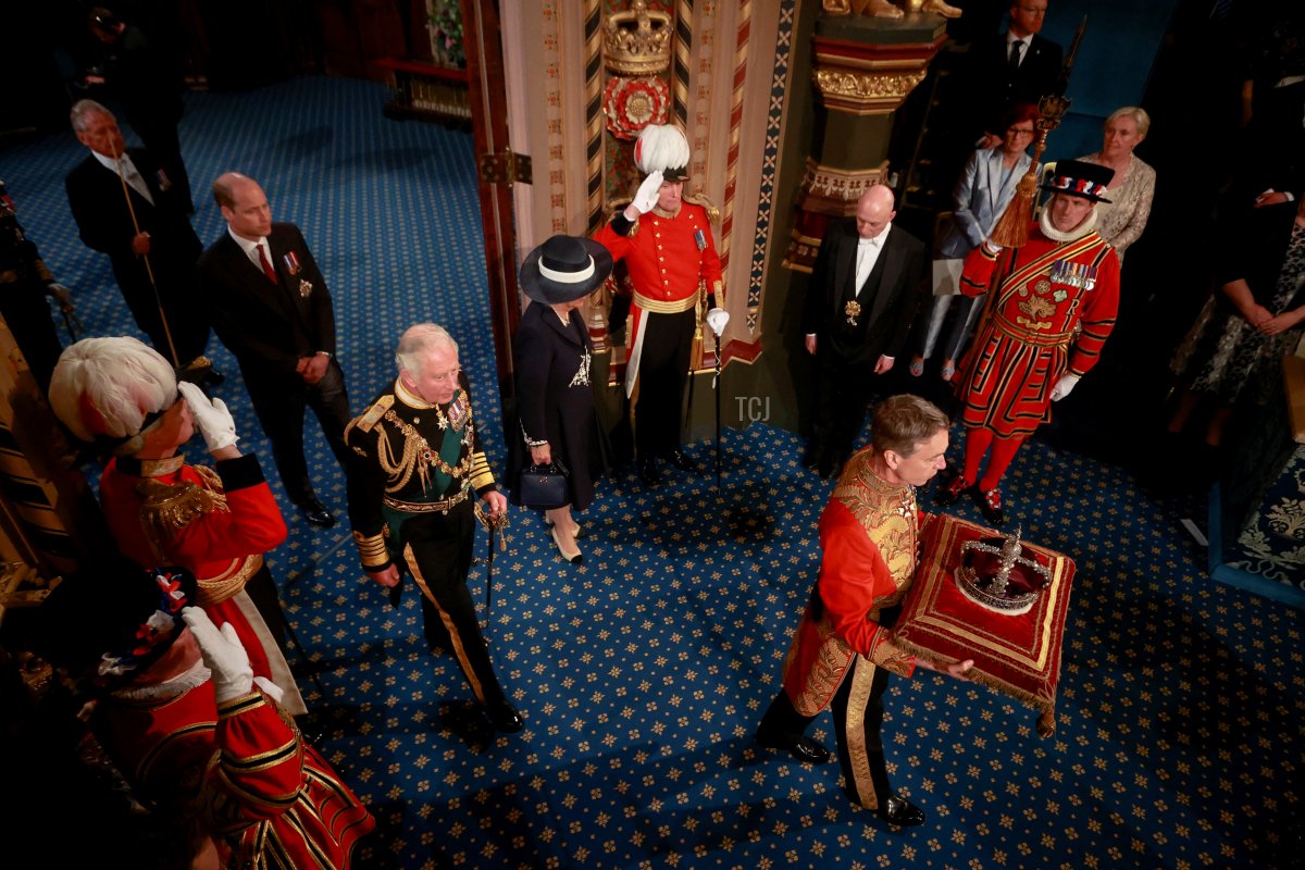 Prince Charles, Prince of Wales, Camilla, Duchess of Cornwall and Prince William proceed behind the Imperial State Crown through the Royal Gallery after Prince Charles delivered the Queen's Speech during a ceremony for the State Opening of Parliament at the Palace of Westminster on May 10, 2022 in London, England