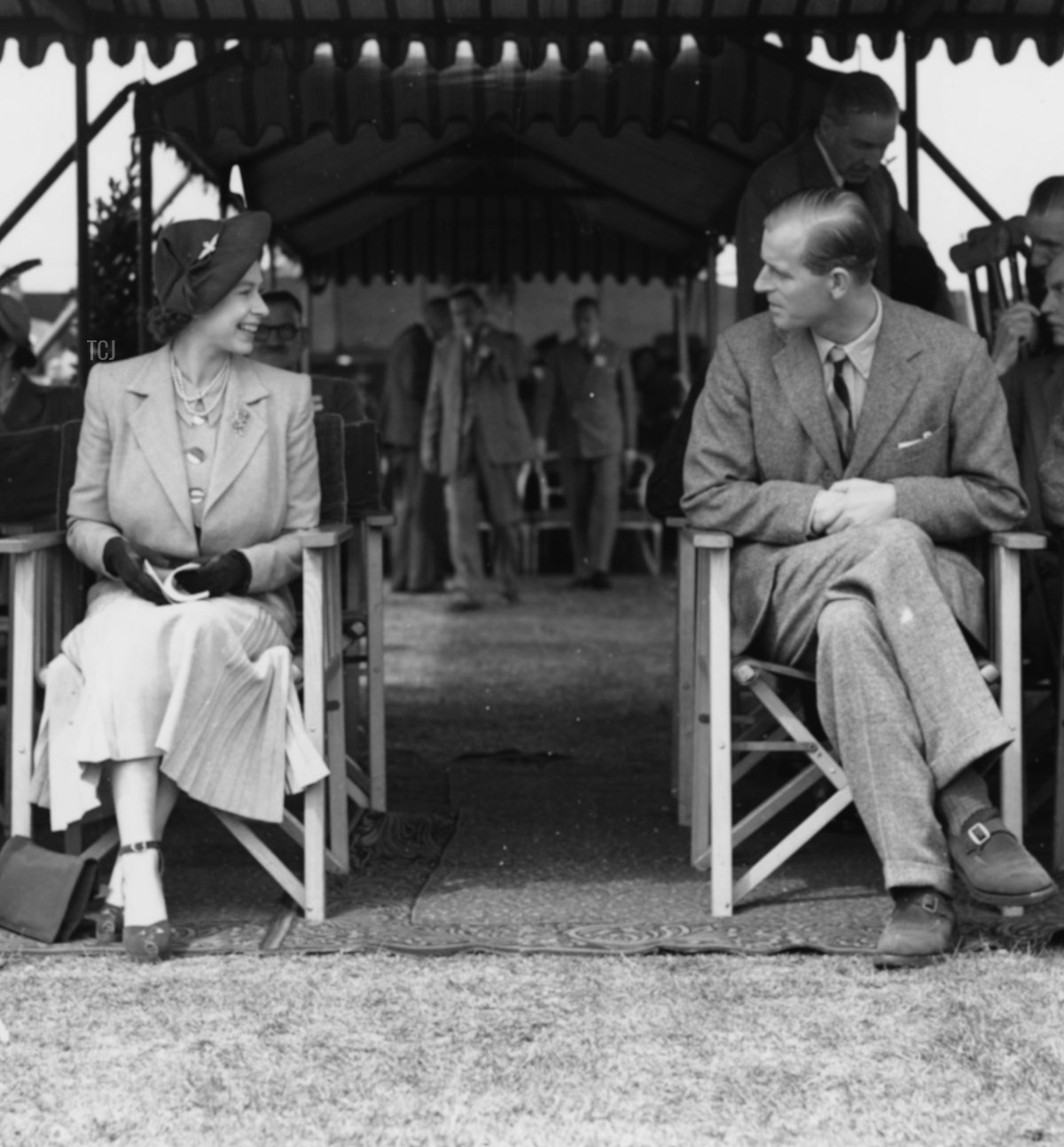 Princess Elizabeth talking to Prince Philip (second right), the Duke of Edinburgh, at the Royal Horse Show at Windsor, England, May 12th 1949