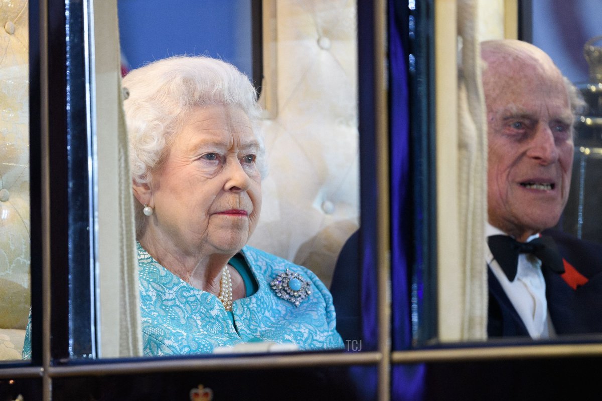 Britain's Queen Elizabeth II accompanied by her husband Prince Philip, Duke of Edinburgh arrives to attend the final night of The Queen's 90th Birthday Celebrations at the Royal Windsor Horseshow in the grounds of Windsor Castle, west of London on May 15, 2016