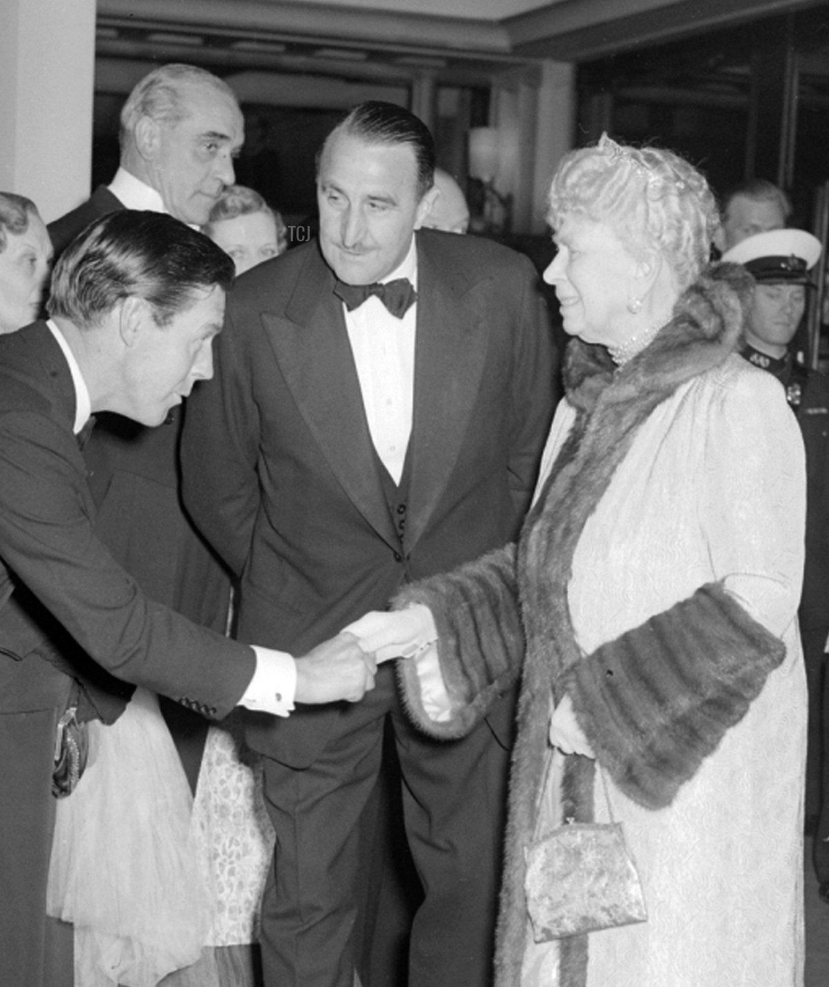 28th June 1951: Film director Charles Crichton, meets Queen Mary, before she attended the charity premier of the directors "The Lavender Hill Mob" at the Odeon Marble Arch