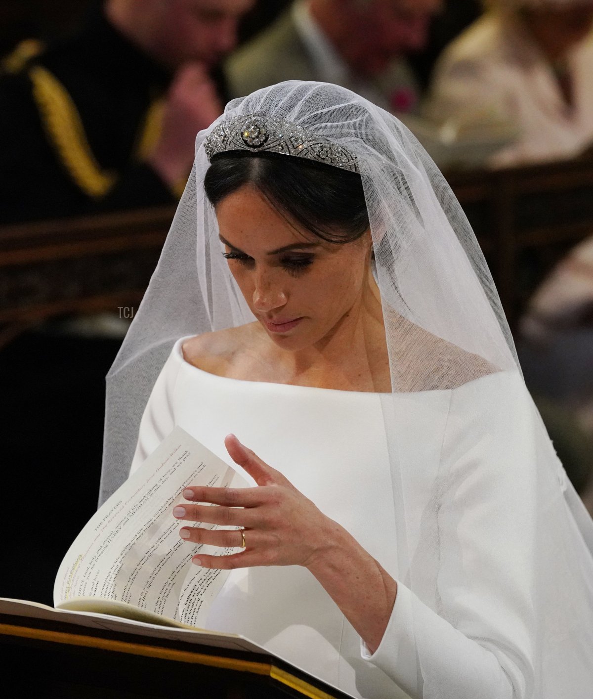 US fiancee of Britain's Prince Harry, Meghan Markle at the High Altar during her wedding to Britain's Prince Harry, Duke of Sussex in St George's Chapel, Windsor Castle, in Windsor, on May 19, 2018