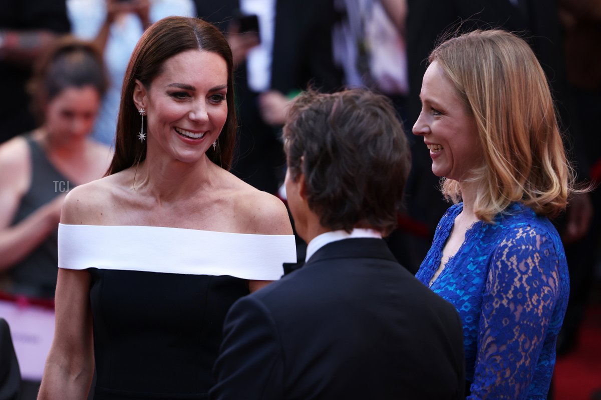 Catherine, Duchess of Cambridge talks with actor Tom Cruise as she arrives for the "Top Gun: Maverick" Royal Film Performance at Leicester Square on May 19, 2022 in London, England