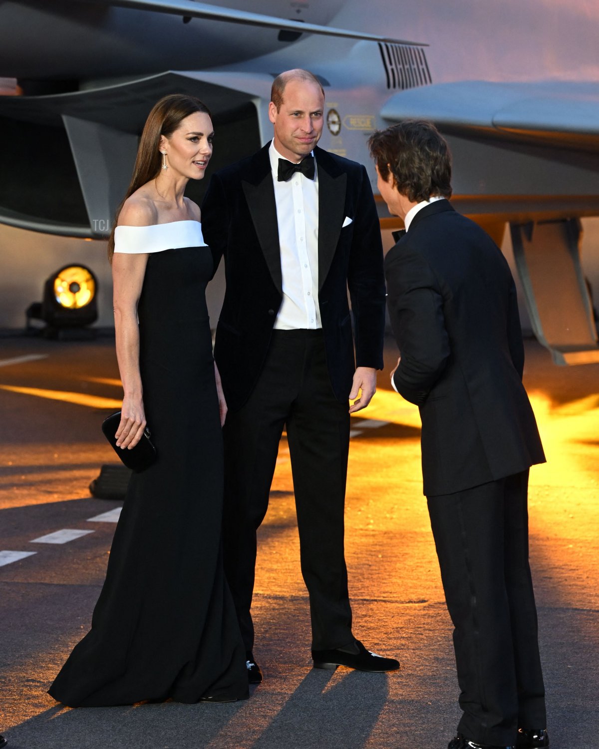 Britain's Prince William, Duke of Cambridge (C) and Britain's Catherine, Duchess of Cambridge (L) speak with US actor Tom Cruise (R) as they arrive for the UK premiere of the film "Top Gun: Maverick" in London, on May 19, 2022