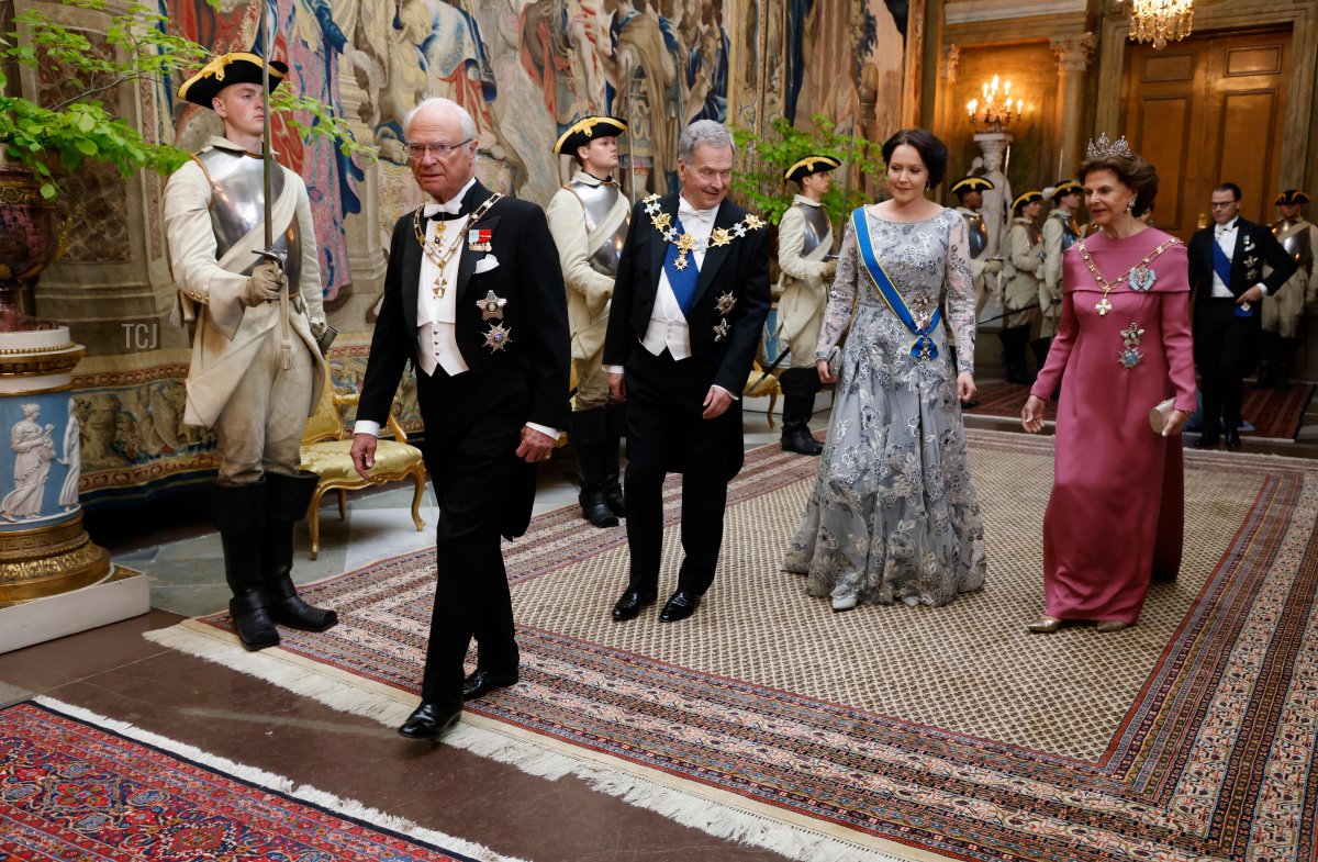 Sweden's King Carl XVI Gustaf, Finnish President Sauli Niinisto and his wife Jenni Hauki and Sweden's Queen Silvia arrive at the Royal Palace as the royal couple will hold a state banquet in honour of Finland's President in Stockholm on May 17, 2022