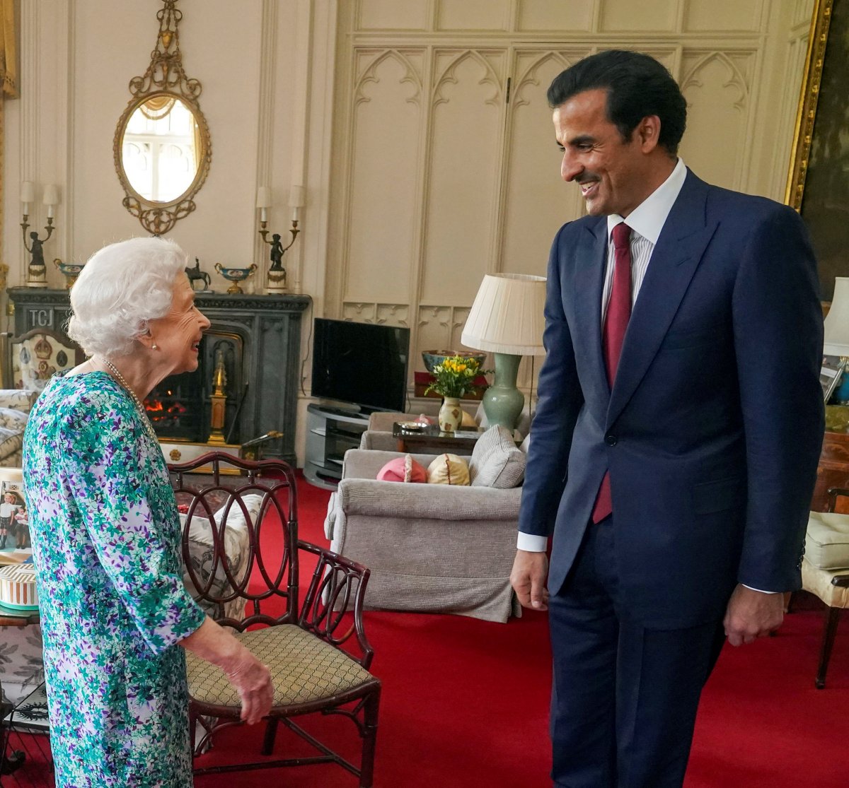 Britain's Queen Elizabeth II greets the Emir of Qatar Sheikh Tamim bin Hamad al-Thani during an audience at Windsor Castle, west of London on May 24, 2022