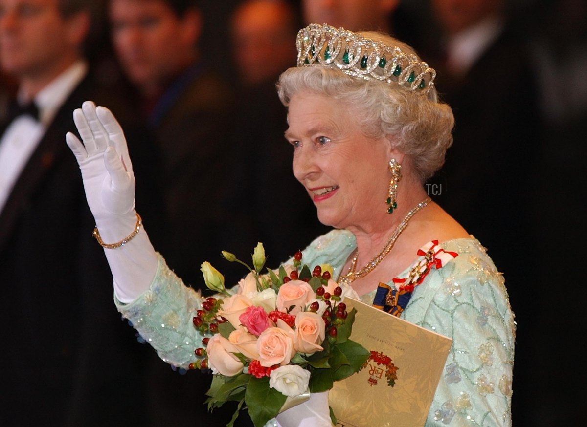 Britain's Queen Elizabeth II waves to the crowd following an evening gala event as part of the Queen Elizabeth II Golden Jubilee Celebration in Toronto, Canada, on 10 October 2002