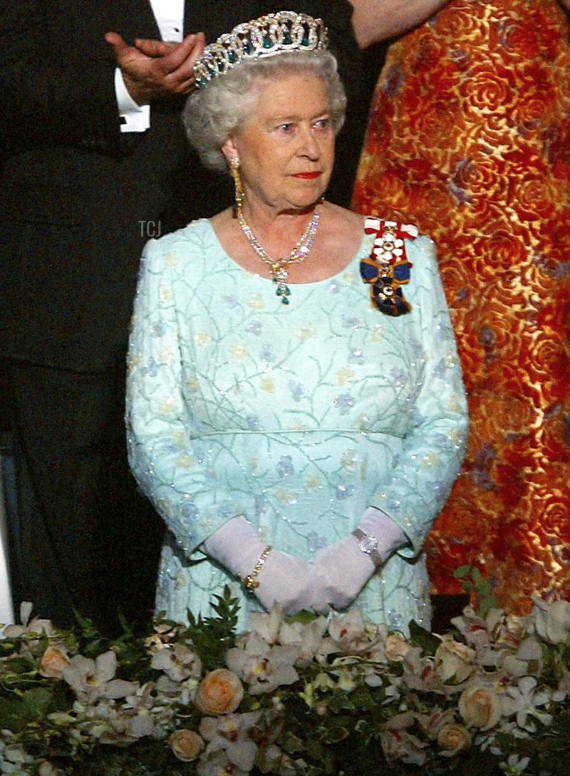 Britain's Queen Elizabeth II stands in the Royal Box prior to a gala in Toronto 10 October 2002