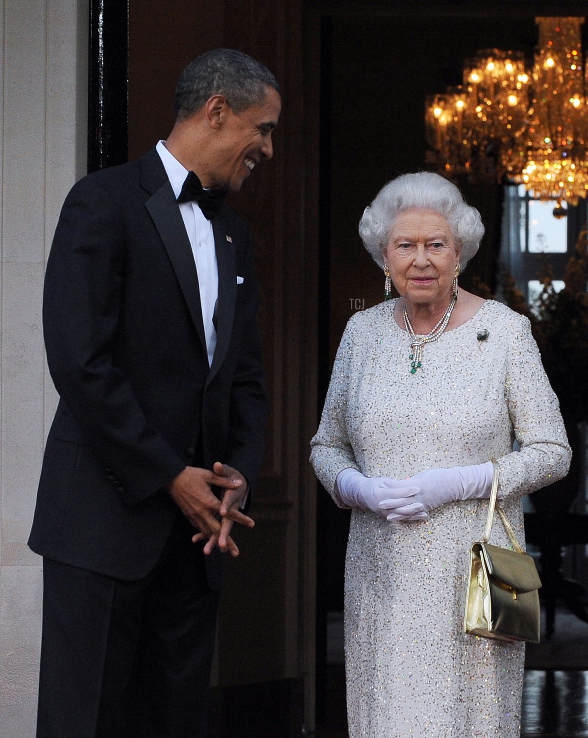 US President Barack Obama (L) greets Britain's Queen Elizabeth II for a reciprocal dinner at the Winfield House in London, on May 25, 2011