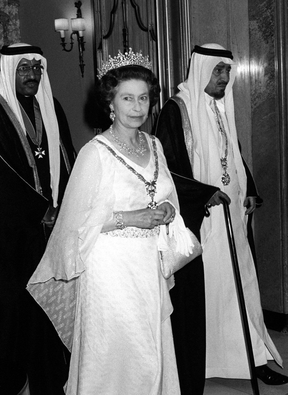 The Queen wears the King Khalid Necklace (with the Girls of Great Britain and Ireland Tiara and the Antique Girandole Earrings) for a return banquet at Claridge’s Hotel during the Saudi state visit, June 1981