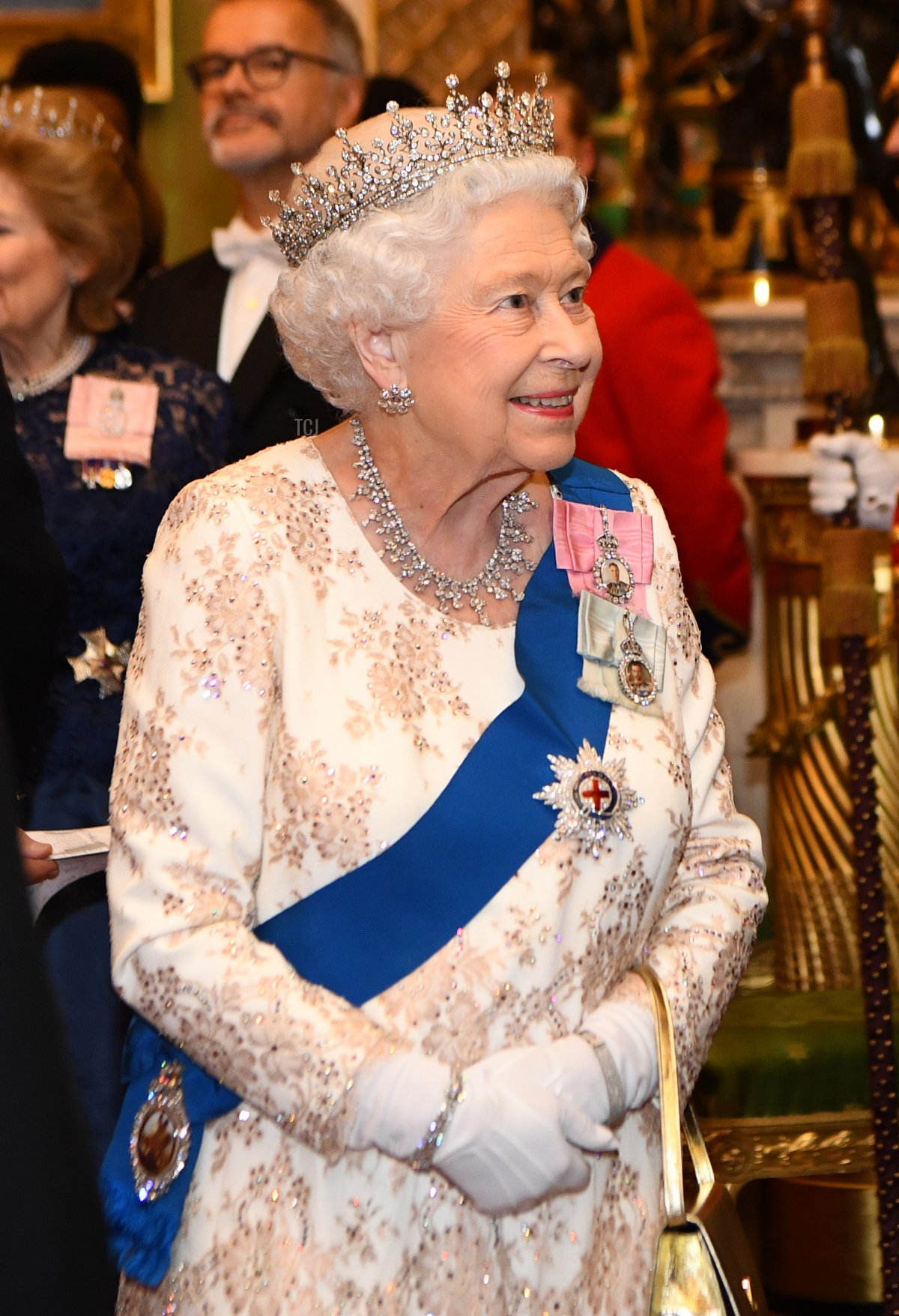 Queen Elizabeth II greets greets the family of the ambassador of Norway at an evening reception for members of the Diplomatic Corps at Buckingham Palace on December 04, 2018 in London, England
