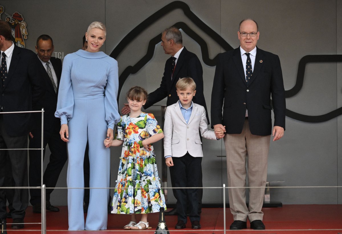 Prince Albert II (R) and Princess Charlene (L) of Monaco stand with their children Jacques and Gabriella on the podium after the Monaco Formula 1 Grand Prix at the Monaco street circuit in Monaco, on May 29, 2022