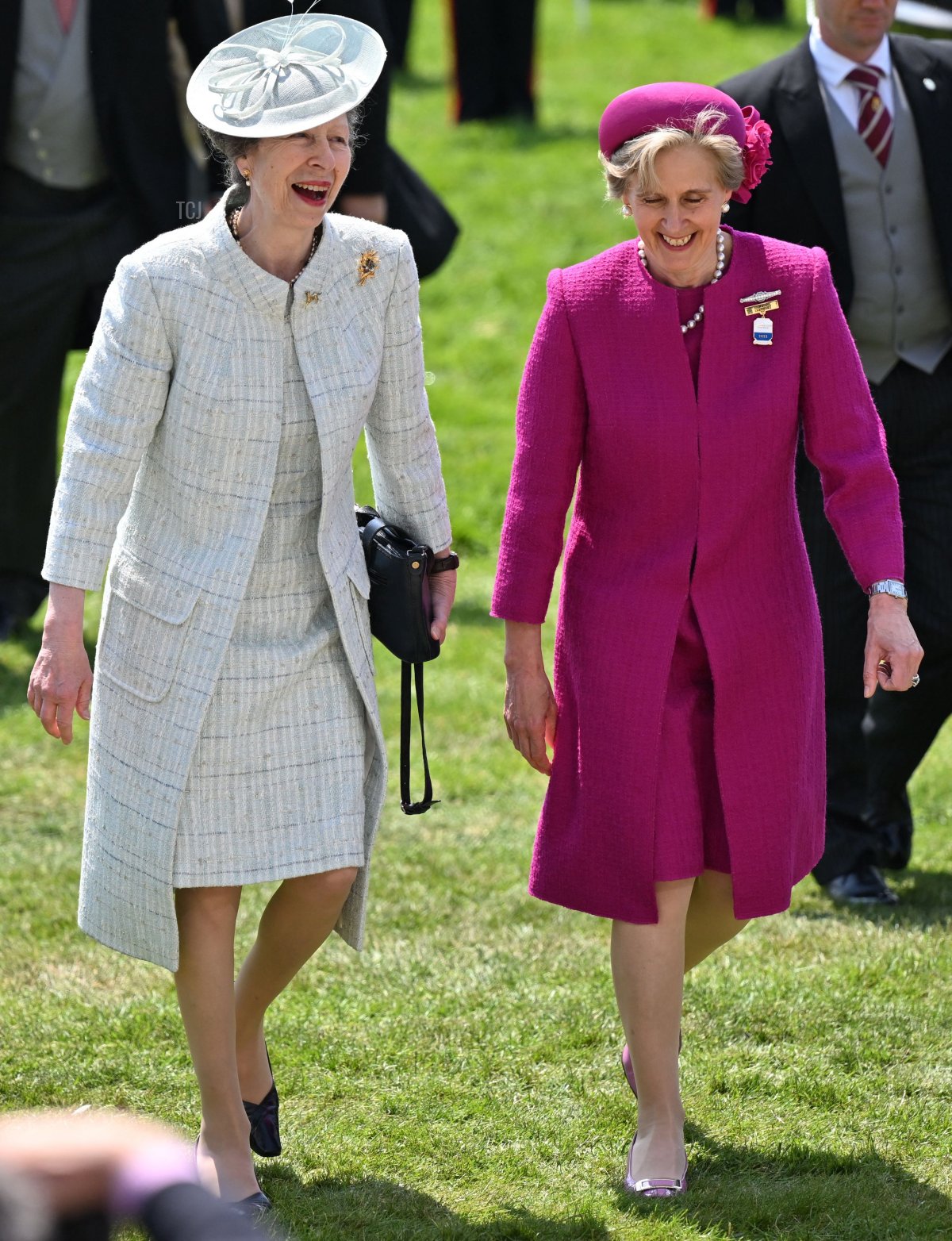 Britain's Princess Anne, Princess Royal (L) shares a joke with Chair of Epsom Racecourse, Julia Budd (R) as they attend the second day of the Epsom Derby Festival horse racing meeting at Epsom Downs Racecourse in Epsom, south of England, on June 4, 2022