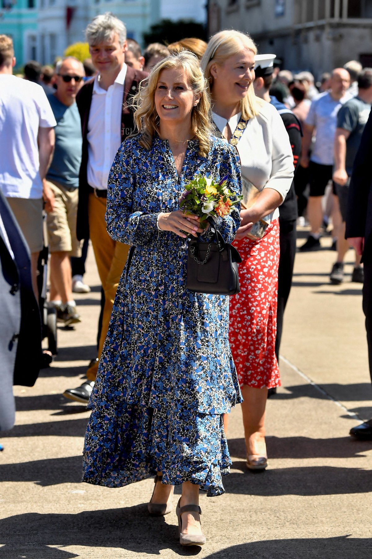 Britain's Sophie, Countess of Wessex, walks with a bouquet of flowers during a visit to Bangor in Northern Ireland on June 4, 2022 as part of the royal family's tour for Queen Elizabeth II's platinum jubilee celebrations