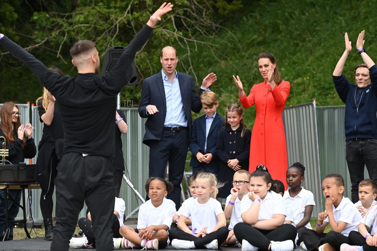 Britain's Prince William, Duke of Cambridge, Britain's Catherine, Duchess of Cambridge, and their children Britain's Prince George and Britain's Princess Charlotte applaud a rehearsal as they visit Cardiff Castle in Wales on June 4, 2022 as part of the royal family's tour for Queen Elizabeth II's platinum jubilee celebrations