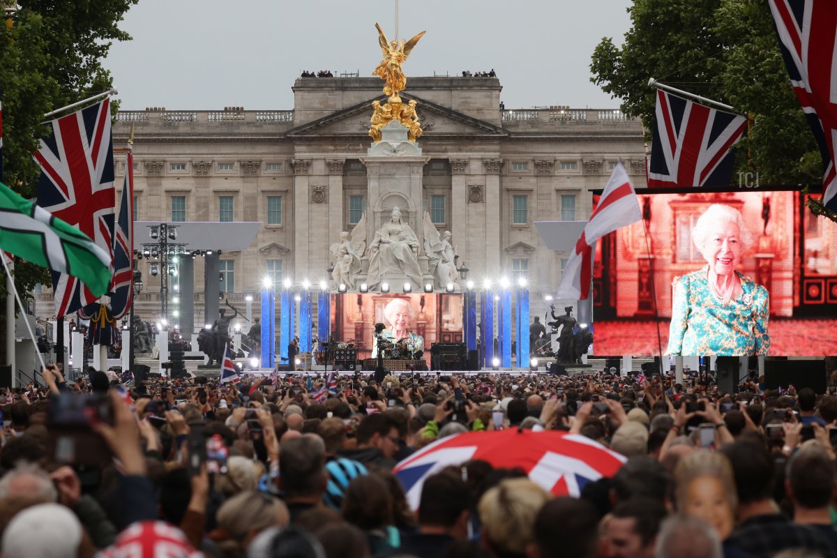 People gather along The Mall for the Platinum Party At The Palace concert outside Buckingham Palace on June 4, 2022 in London, United Kingdom