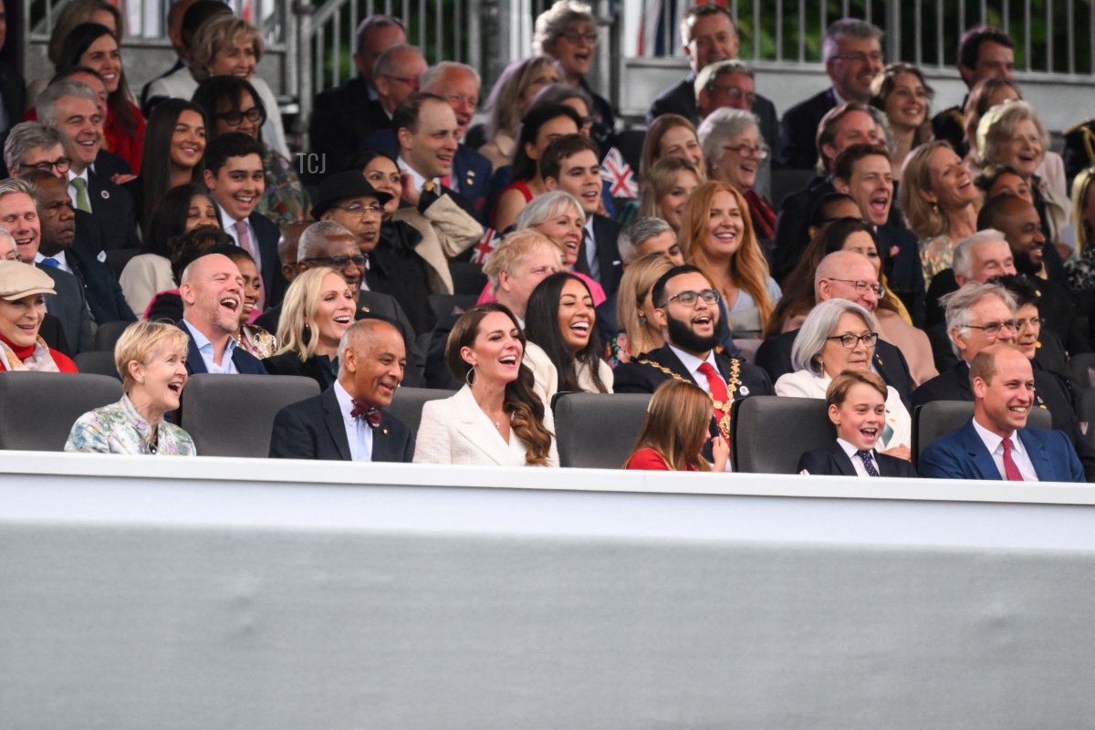 Britain's Catherine, Duchess of Cambridge, Britain's Princess Charlotte of Cambridge, Britain's Prince George of Cambridge and Britain's Prince William, Duke of Cambridge, react during the Platinum Party at Buckingham Palace on June 4, 2022 as part of Queen Elizabeth II's platinum jubilee celebrations