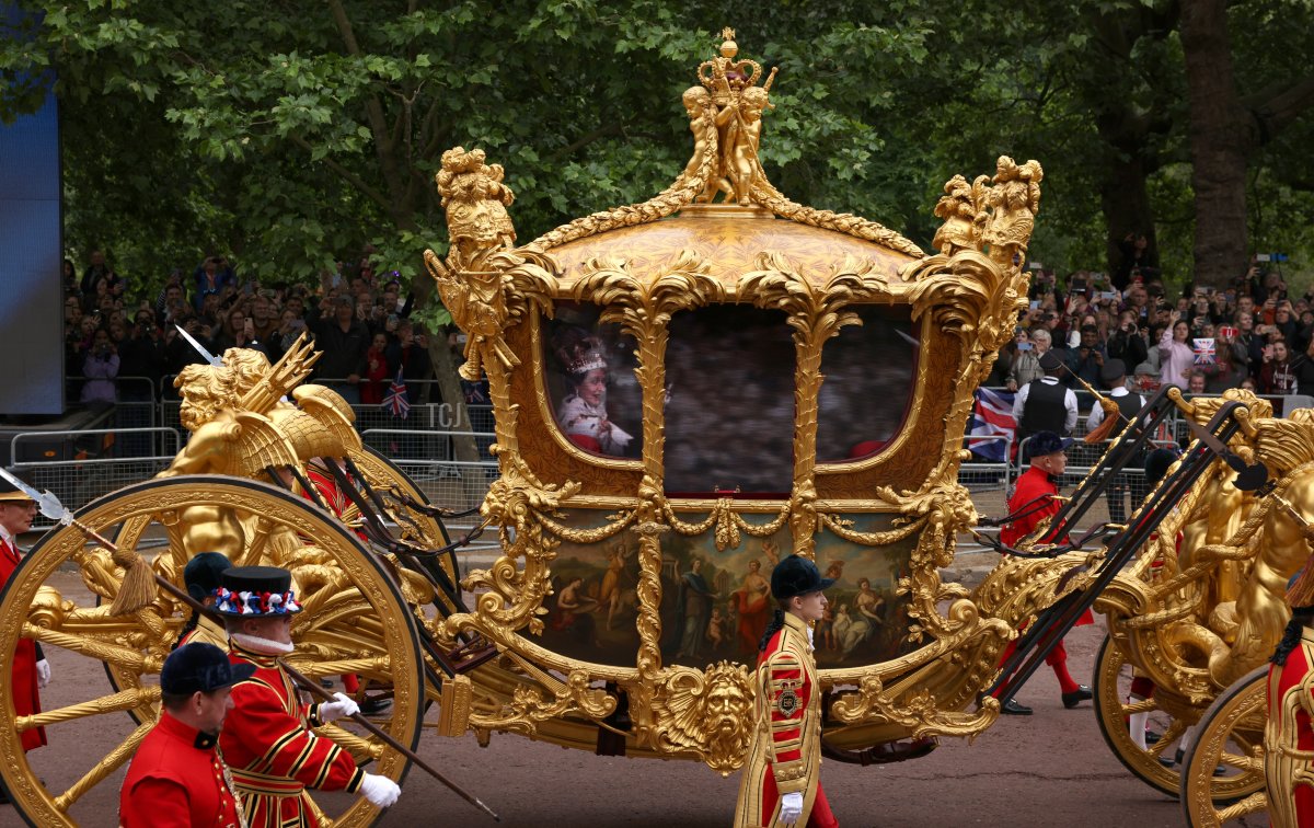 The Gold State Coach with an hologram of the Queen inside during the Platinum Pageant on June 05, 2022 in London, England