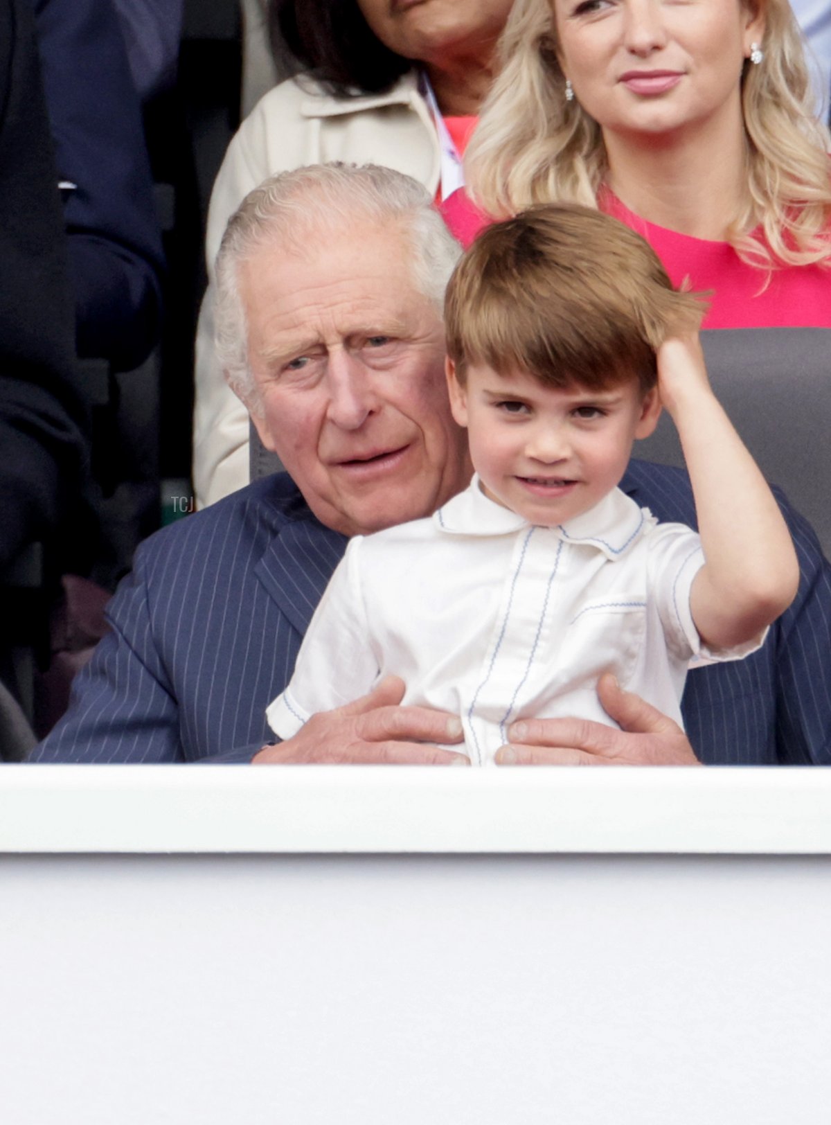 Camilla, Duchess of Cornwall, Prince Charles, Prince of Wales, and Prince Louis of Cambridge watch the Platinum Pageant on June 05, 2022 in London, England