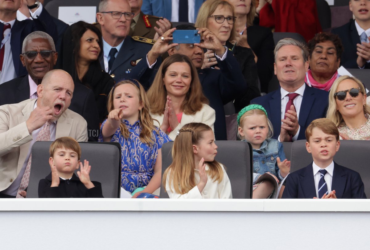 Mike Tindall, Mia Tindall, Victoria Starmer, Lena Tindall, Keir Starmer, Zara Tindall (front row) Prince Louis of Cambridge, Princess Charlotte of Cambridge and Prince George of Cambridge watch the Platinum Pageant on June 05, 2022 in London, England