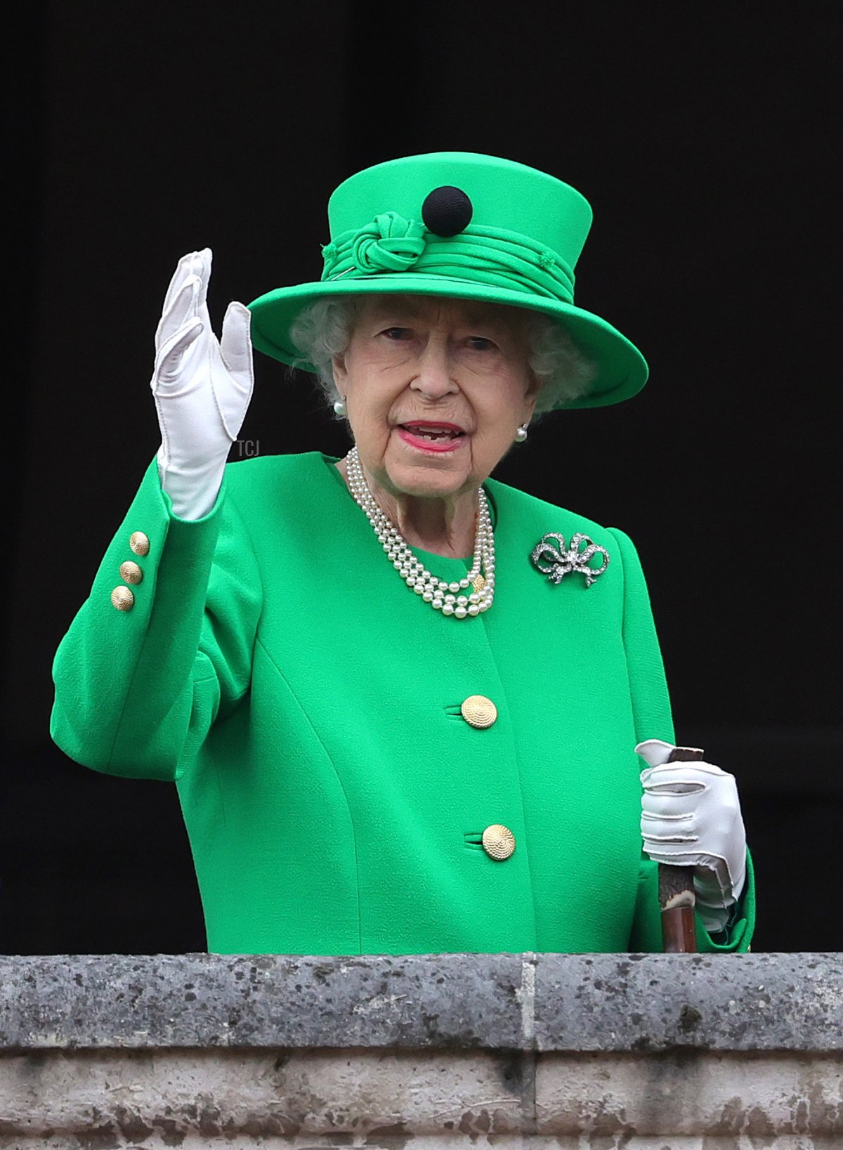 Queen Elizabeth II waves on the balcony during the Platinum Pageant on June 05, 2022 in London, England