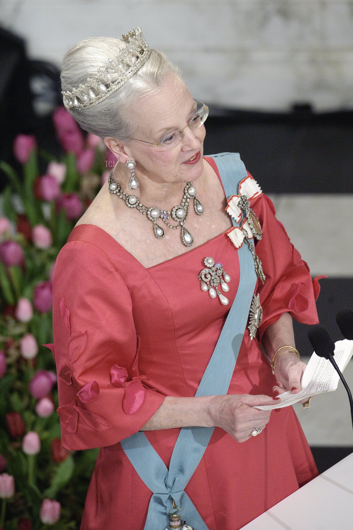 Danish Queen Margrethe raises delivers a speech at Christiansborg Palace in central Copenhagen on April 13, 2010 during the official dinner party in celebration of the queens 70 years birthday